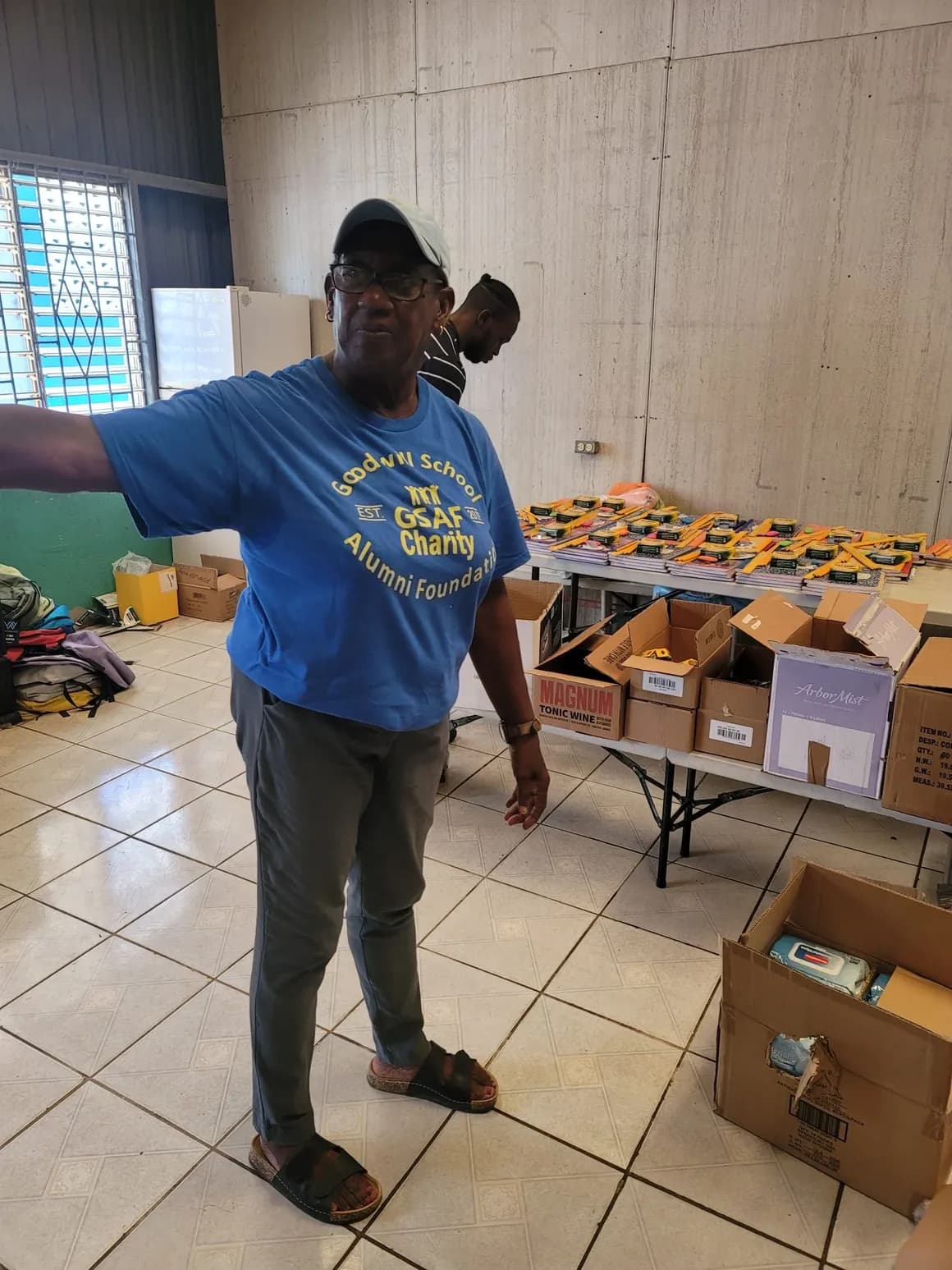 Goodwill School Alumni Foundation volunteer organizing supplies