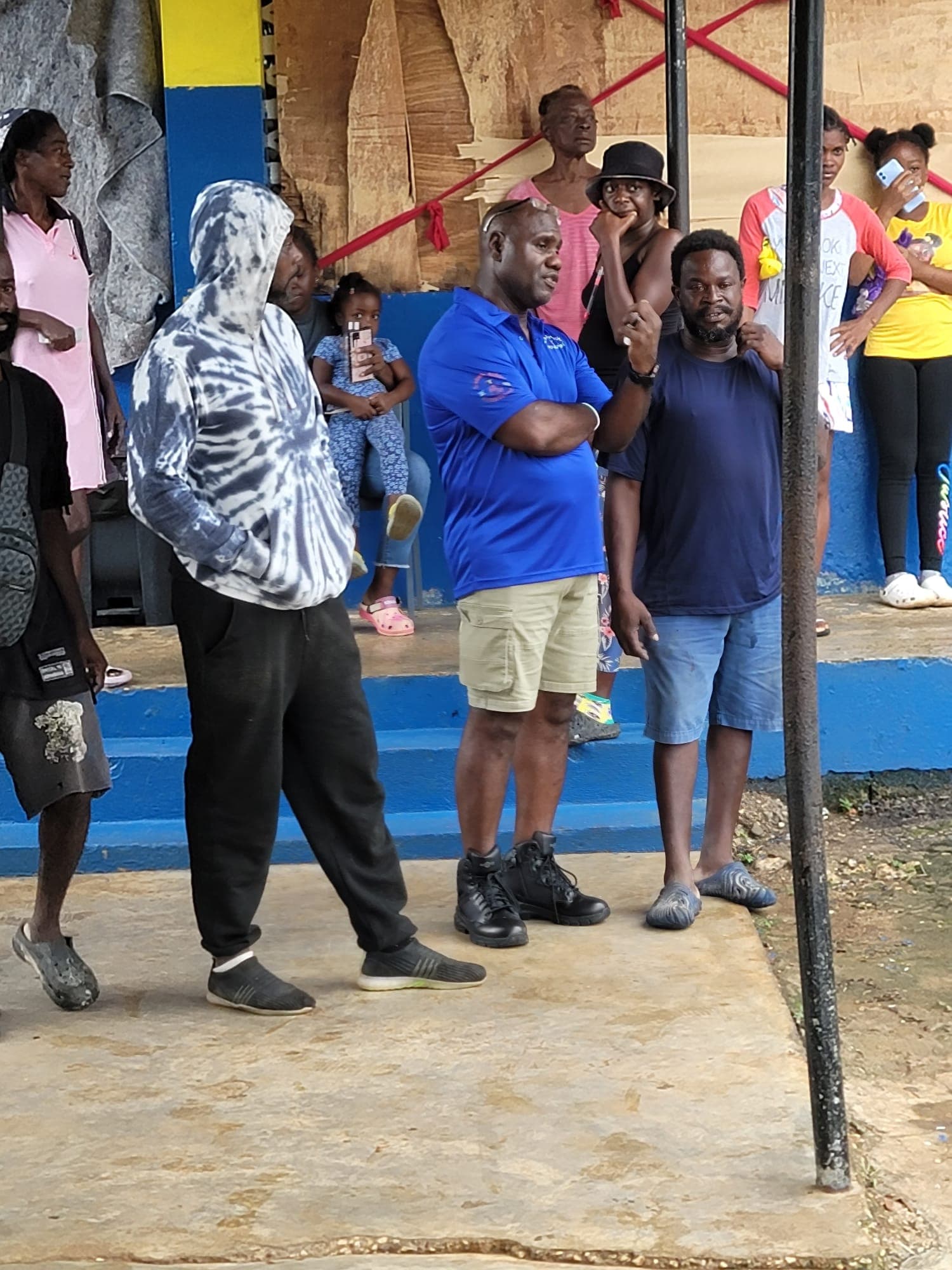 Community members receiving emergency supplies after Hurricane Melissa