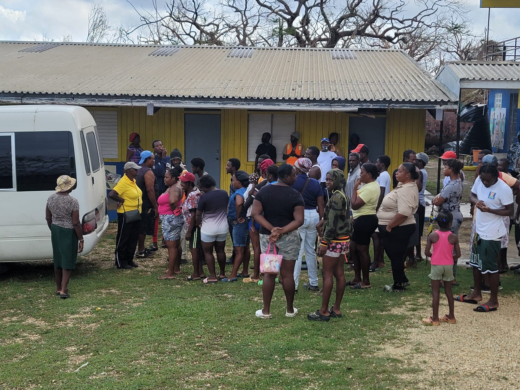 Community members gathered for hurricane relief supply distribution